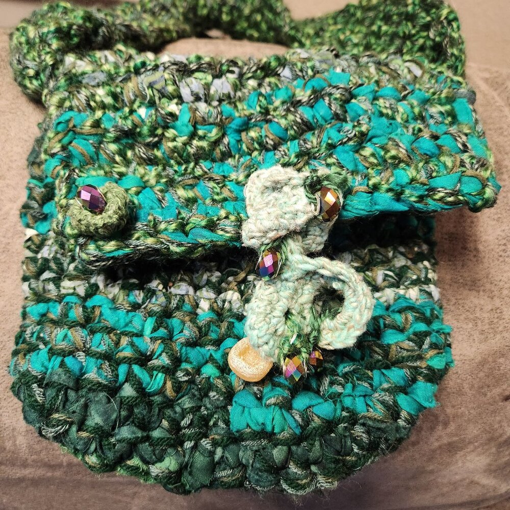 Free form crocheted mini purse. 8x8in.